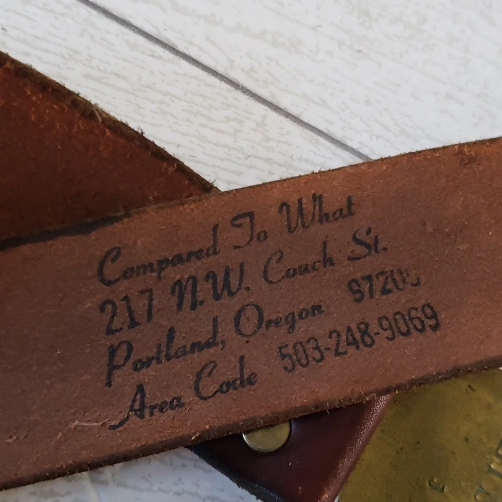 Compared to what brown leather strap with gold buckle